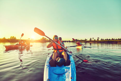 Wild nature and water fun on summer vacation. Camping and fishing.