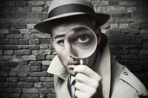 detective-with-magnifying-glass